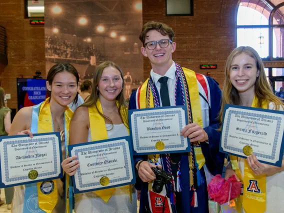 In order from left to right; Alexandra Jaeger, Courtney Olenski, Brandon Good, & Surya Fitzgerald showing off their recently received diplomas.