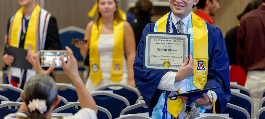 Darrell Mason showing off recently received diploma.